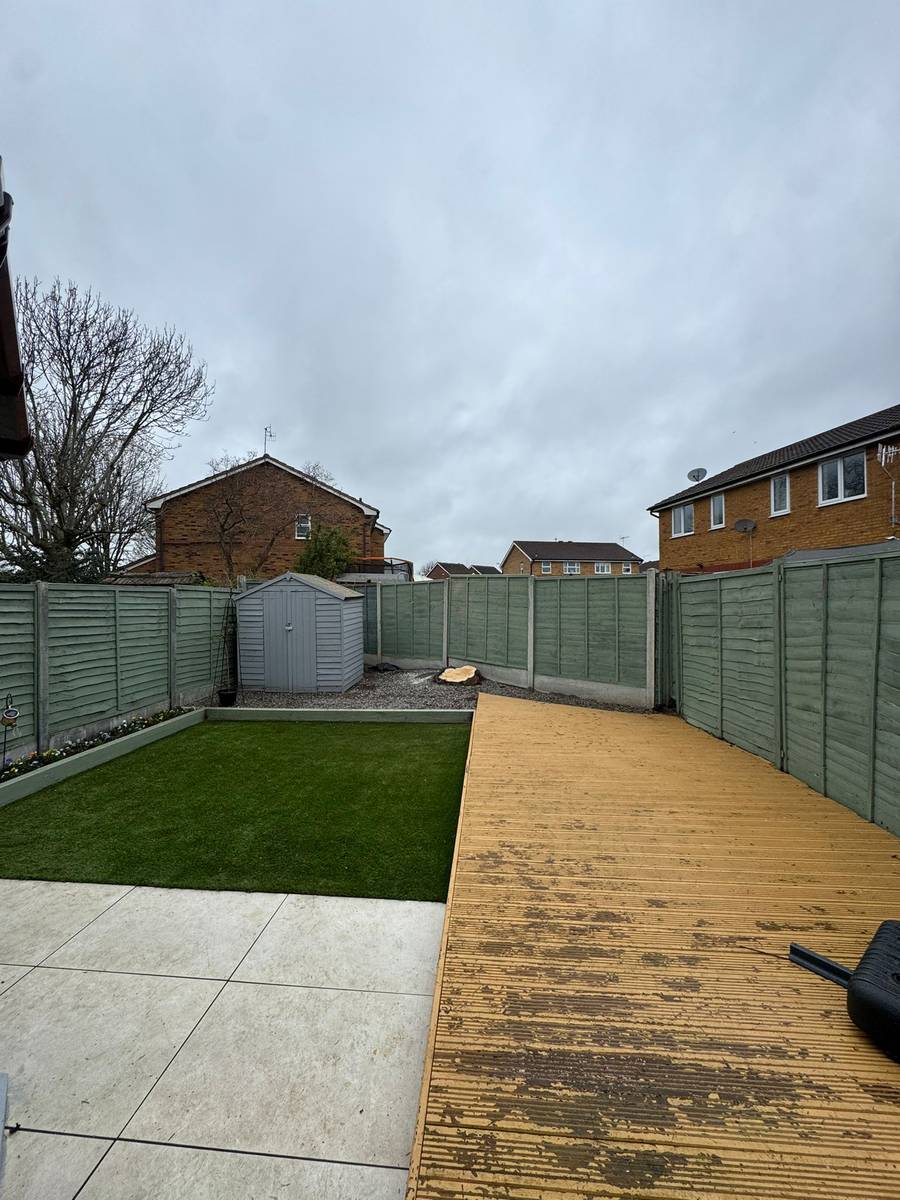 Residential garden cleared with fresh lawn and deck